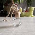 5PCS Hanging Car Air Freshener, Auto Interior Decoration 8 ml Oil Diffuser Perfume Aromatherapy Pendant Empty Glass Bottle, Fragrance Ornament with Vent Clip Wooden Cap and Rope (Apple)