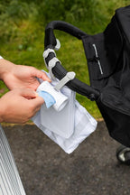Ubbi Retractable On the Go Bag Dispenser for Baby Travel, Diaper Accessory Must Have for Newborn, Helpful Item, Baby Gift, Lavender Scented, White